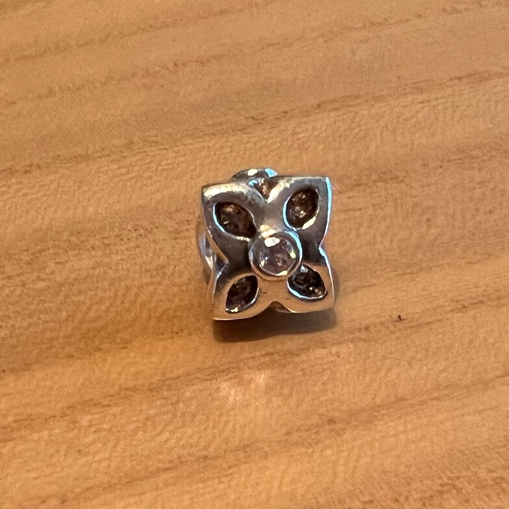 Authentic Pandora Flower charm with pink stone in center